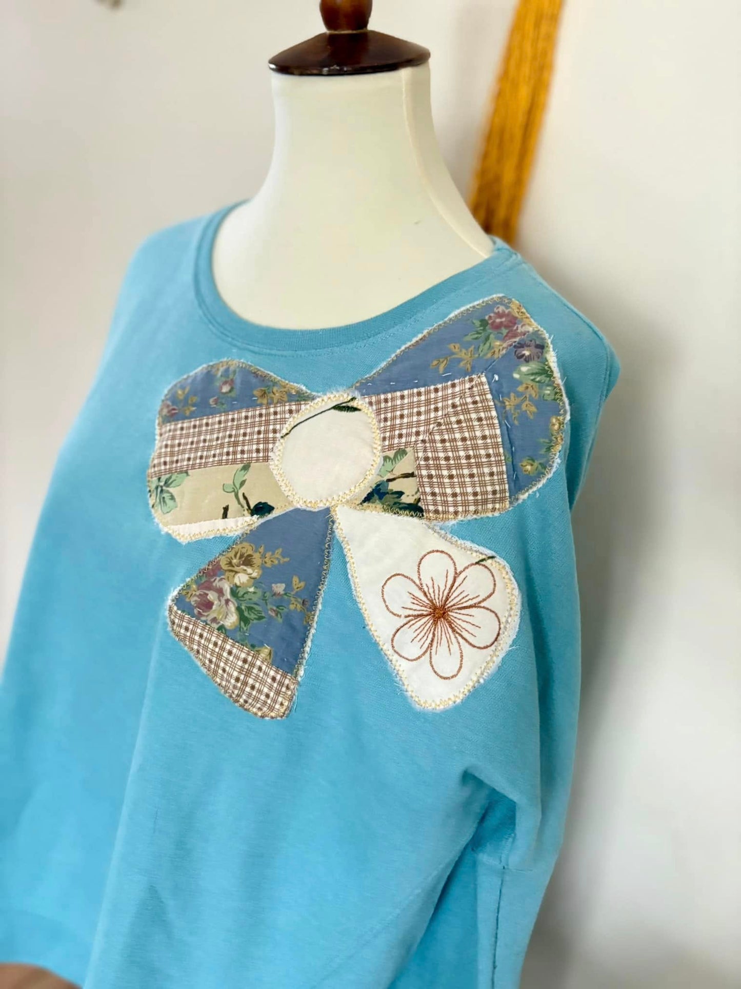 Upcycled quilt bow sweatshirt size lg