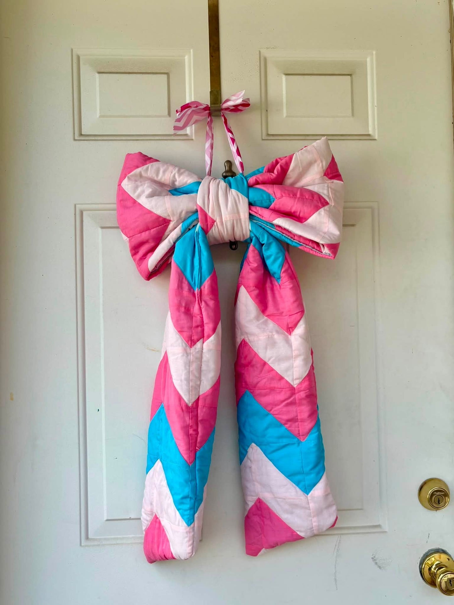 Pink and blue quilted door bow
